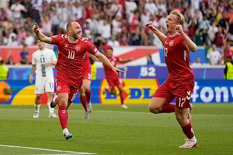 Denmark players celebrate teams opening goal